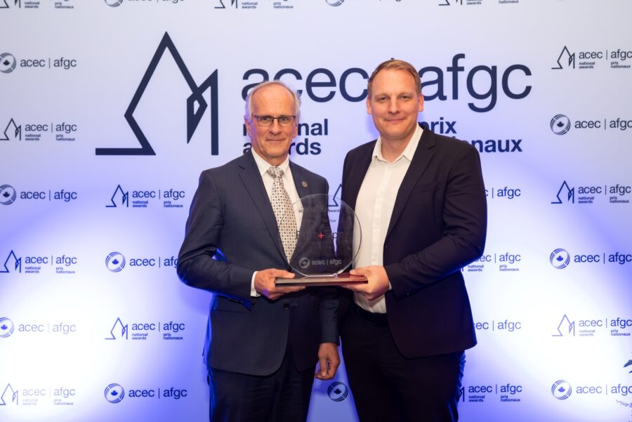 Fast + Epp Partners, Paul Fast and Robert Jackson, pose with the ACEC award for Limberlost Place at the ACEC Awards Gala