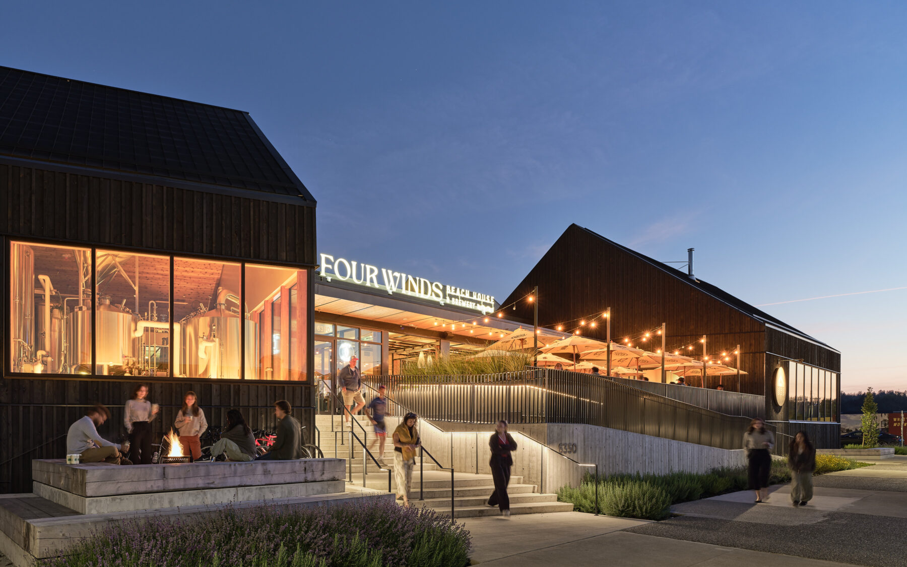 The Granary at Southlands, exterior image of Four Winds Restaurant at dusk