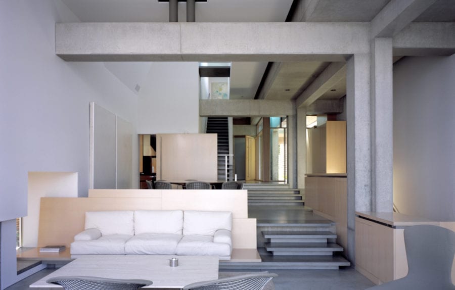 Interior living room area of Shaw House, showing detailed exposed cast-in-place concrete and steel.